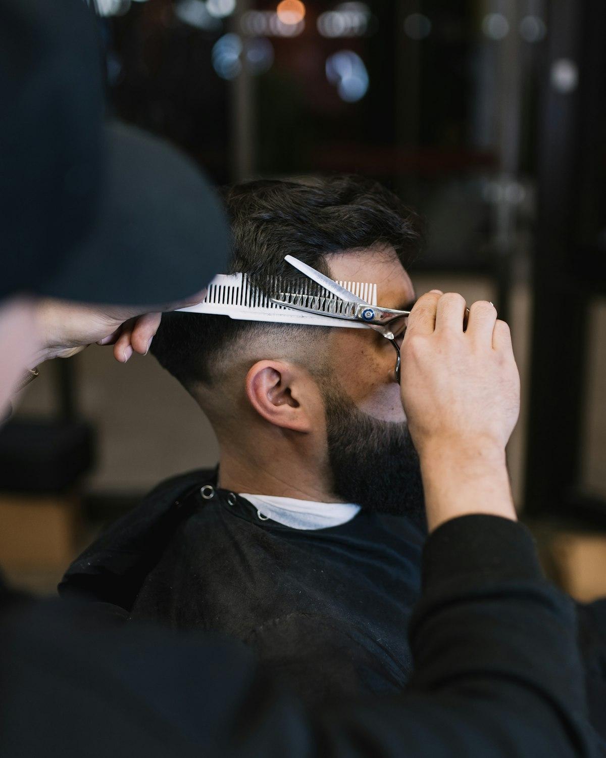 Barber cutting a client's hair
